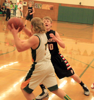 Brandon Higgins harasses the Potlatch ballhandler as Prairie applies a full court press on defense.