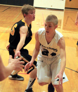 Caleb Currier drives toward the hoop. He was one of Summit Academys two seniors honored on Senior Night Saturday.
