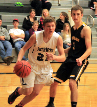 Summits Jake Stubbers drives the baseline against Highland.
