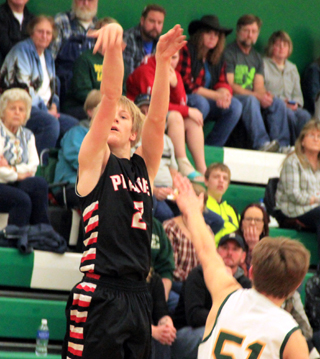 Tyson Schlader puts up a shot from the outside at Potlatch.