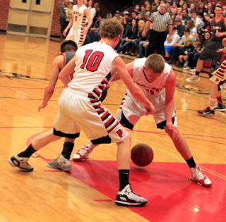 Brandon Higgins and Jake Bruner force a turnover against C.V.