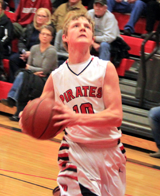 Brandon Higgins goes for a layup against C.V.