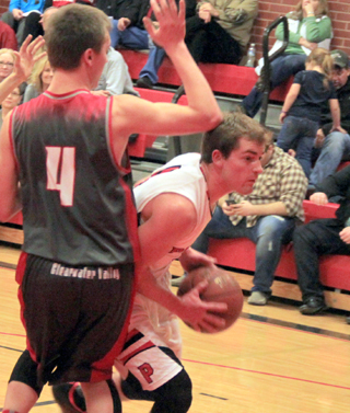 Isaiah Shears looks to get around a C.V. defender for a shot.