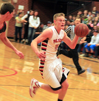 Jake Bruner drives toward the hoop in his final home game of an outstanding high school career.