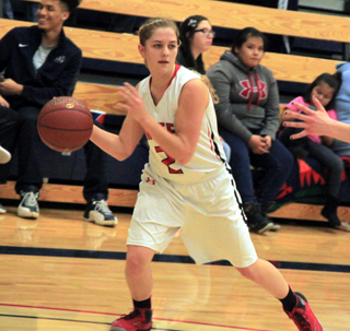 Kylie Tidwell looks to make a pass.