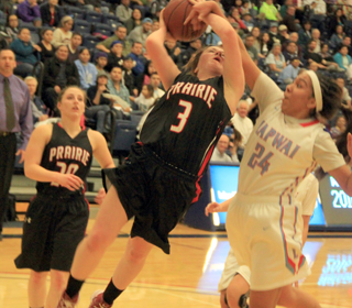 Angela Wemhoff gets fouled as she goes for a shot against Lapwai in the District Championship game. Also shown is Hailey Danly.