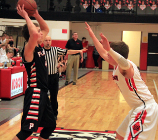 Isaiah Shears looks to make a pass in the boys game at Moscow.