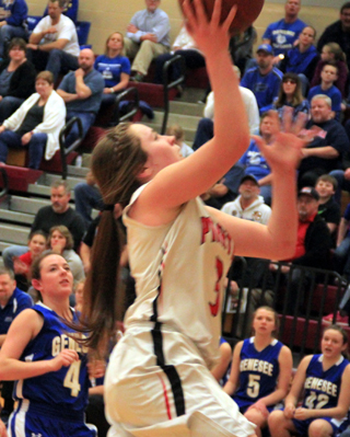 Angela Wemhoff goes for a lay-up against Genesee at State.