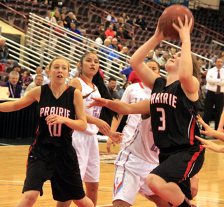 Angela Wemhoff goes for a layup in the championship game against Lapwai. Also shown is Talyss Lustig.