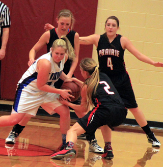 Kylie Tidwell forces a jump ball in the Valley game at State. Also shown are Talyss Lustig and Shayla VonBargen.