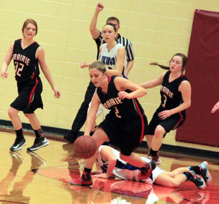 Kylie Tidwell comes away with a steal against Valley although it appears the referee is calling a foul. Also shown are Josie Peery and Angela Wemhoff.
