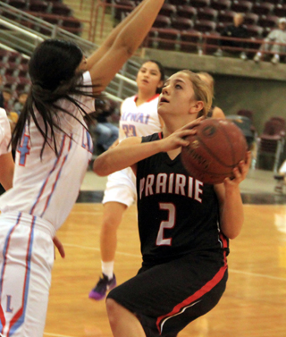 Kylie Tidwell looks to shoot against Lapwai.
