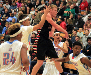 Jake Bruner makes a pass to someone who has to be open as he is surrounded by 4 Lapwai defenders.