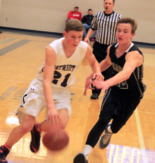 Jake Stubbers drives past a Deary defender.