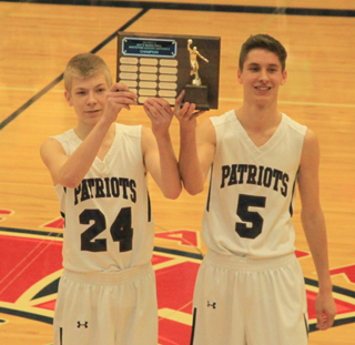 Seniors Caleb Currier and Dean Stubbers accepted the league championship trophy prior to the Deary game.