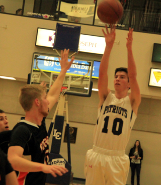 Tyler Krogh puts up a jump shot against Kendrick.