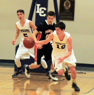Tyler Krogh steals the ball against Kendrick. Also shown is Dean Stubbers.