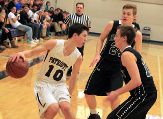 Tyler Krogh gets double-teamed by Deary.