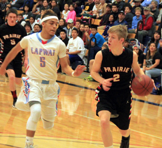 Tyson Schlader drives towards the hoop.
