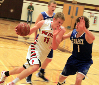 Jake Bruner drives toward the hoop against Genesee at State.