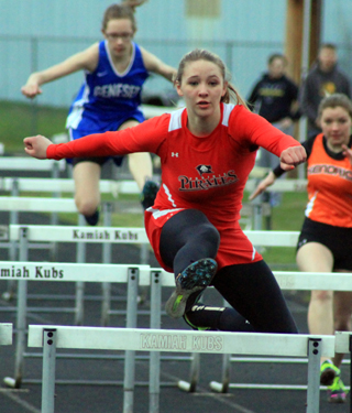 Mykaela McWilliams clears the last hurdle on her way to a win in the 100 meter hurdles where she had the areas best time so far this season. She also won the 300 hurdles.