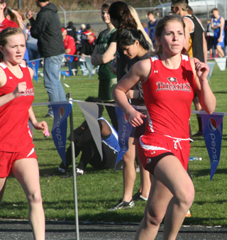 Jordyn Higgins and Chaye Uptmor in the 800 meter run at Lapwai last week. Photo by Steve Wherry.