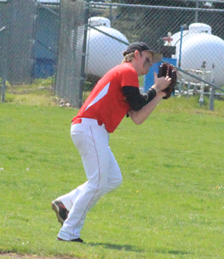 Shortstop Devin Bruegeman makes an over the shoulder catch in the first game against Potlatch.