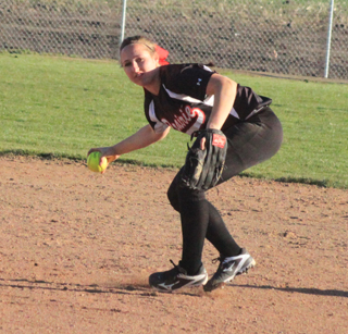 Hailey Danly comes up ready to gun out a Genesee runner at first after knocking down a hard infield grounder.