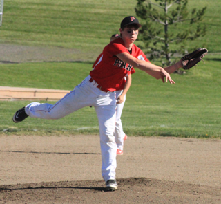 Pitcher Brandon Anderson tosses the ball over to first base for an out at Grangeville.