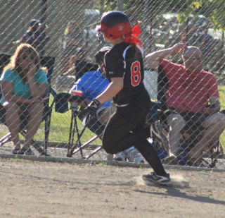 Hailey Danly cuts third as she circled the bases for a home run against Potlatch.
