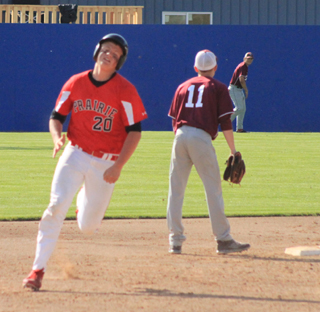Spencer Schumacher heads for third with a triple against Kamiah.