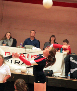 Angela Wemhoff goes for a spike against Kamiah.