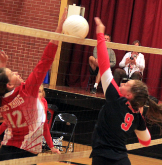 Sydney Bruner won this joust at the net against C.V.