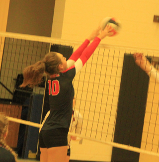 Nicole Poxleitner blocks the ball against Dayton.