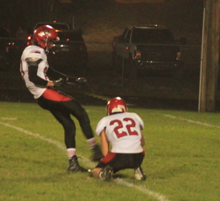 Hunter Chaffee kicked a pair of extra points in the Kamiah game. Holding is Brandon Anderson.