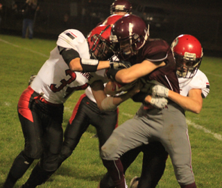 Jayce Huling and Brandon Anderson wrap up a Kamiah ballcarrier.