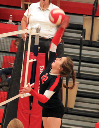 Angela Wemhoff spikes the ball agaisnt Potlatch.