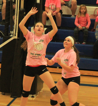 Madison Pecarovich sets the ball at Orofino as Sydney Bruner watches. It was the second Tuesday in a row that Prairie participated in another schools Dig Pink fundraiser.