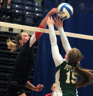 Mykaela McWilliams wins this joust at the net against Potlatch.