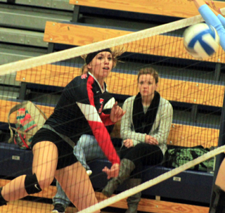 Chaye Uptmor spikes the ball against Lapwai.