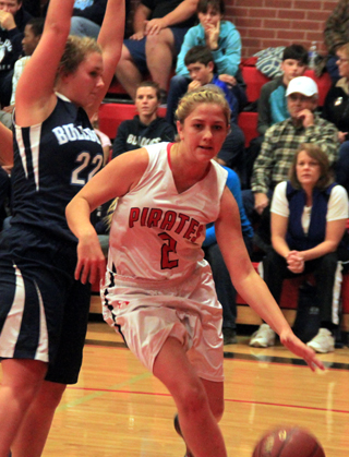 Kylie Tidwell drives the baseline past a Grangeville defender. She wound up going under the basket and scoring on a shot from the other side.