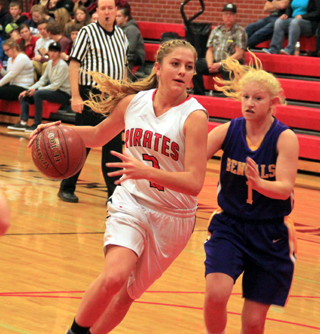 Kylie Tidwell drives past a Lewiston JV defender.