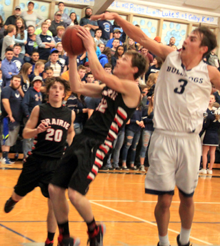 Luke Wemhoff managed to avoid getting his shot blocked on this play by pulling the ball to his right and going up for a lay-up. Also shown is Brandon Anderson.