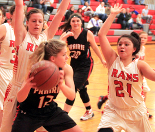 Chaye Uptmor looks to pass out of the low block against C.V. also shown is Sydney Bruner.