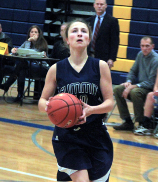 Erin Chmelik goes for a layup at Logos after having stolen the ball.