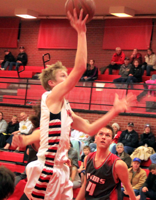 Tyson Schlader goes for 2 of his 17 points against C.V.