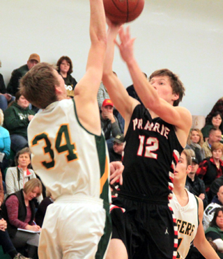 Luke Wemhoff attempts to get a shot up against a Potlatch defender.