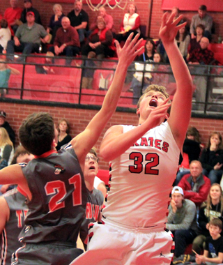Spencer Schumacher scores on a lay-up against Troy.