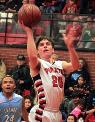 Brandon Anderson scores one of 3 first half lay-ups that helped keep Prairie in the game against Lapwai.