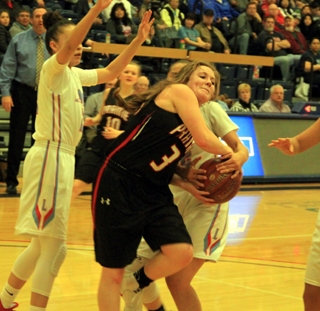 Angela Wemhoff battles Lapwais Iris Domebo who tries to take the ball away.